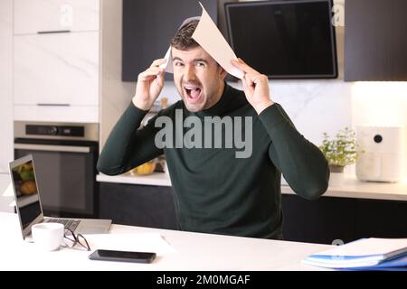 Stressed out working in home office Stock Photo