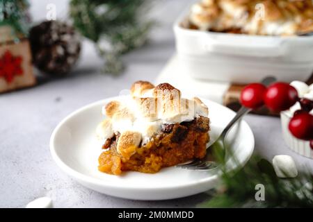 Homemade Sweet potato casserole topped with toasted marshmallows - holiday foods Stock Photo