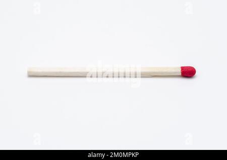 One single new unlit matchstick on white background Stock Photo