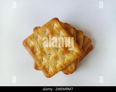 top view of piles of sugar-coated sweet crackers on white background Stock Photo