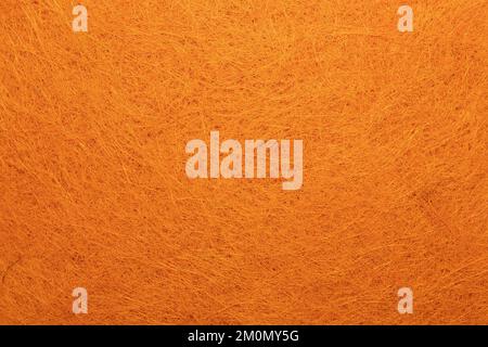 Orange non-woven sisal yarns for backgrounds. Stock Photo