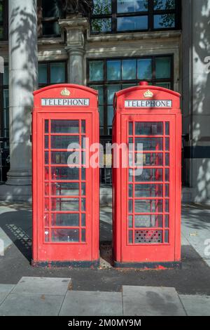 Two red classic british phone boxes in London, UK Stock Photo