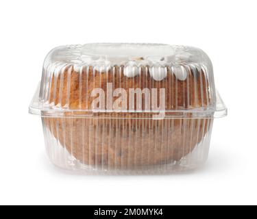 Front view of bundt cake in transparent plastic container isolated on white Stock Photo