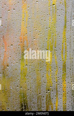 Abstract patterns of condensation on window. Stock Photo
