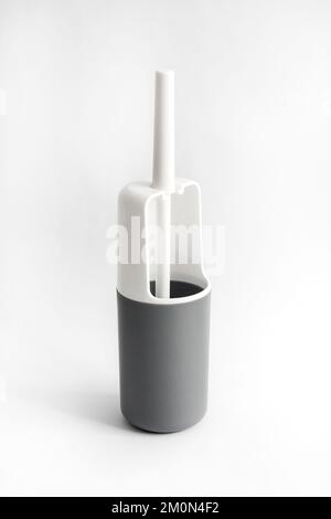 White and gray plastic toilet brush on white background Stock Photo