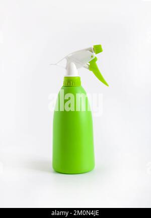 Green plastic spray bottle on white background Stock Photo