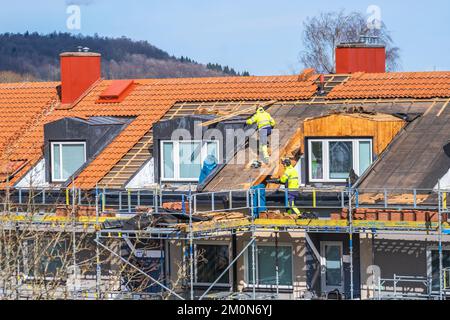 Roofers working on a roof Stock Photo