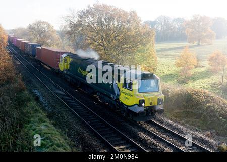 Freightliner class 70 diesel locomotive No. 70002 pulling an intermodal train, Warwickshire, UK Stock Photo