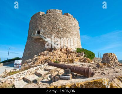Historic Spanish defence defence tower Torre Spagnola La Turri with staircase for sightseeing, in the foreground historic Spanish cannon, Santa Teresa Stock Photo