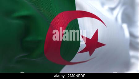 Close-up view of the Algeria national flag waving in the wind. People Democratic Republic of Algeria, is a country in North Africa. Fabric textured ba Stock Photo