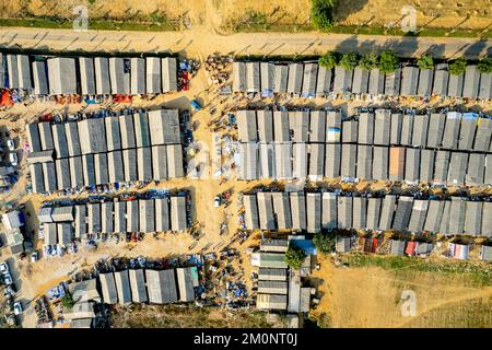 aerial drone top down shot of banjara market in gurgaon delhi showing disorganized temporary tents houses in slums showing this famous handicraft and Stock Photo