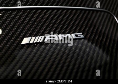 A closeup shot of the Mercedes-Benz AMG badge on carbon fiber center console Stock Photo