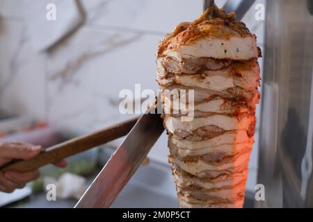 Shawarma. Closeup picture of stacked meat roasting, shawarma. Food in Turkeye Stock Photo