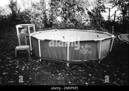 Summer above ground swimming pool, Medstead, Hampshire, England, United Kingdom Stock Photo