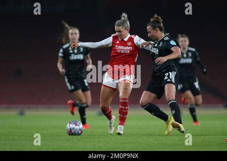 London, UK. 07th Dec, 2022. London, December 7th 2022: Laura Wienroither (26 Arsenal) shields the ball from Arianna Caruso (21 Juventus) during the UEFA Womens Champions League Group C game between Arsenal and Juventus at The Emirates Stadium, London, England. (Pedro Soares/SPP) Credit: SPP Sport Press Photo. /Alamy Live News Stock Photo