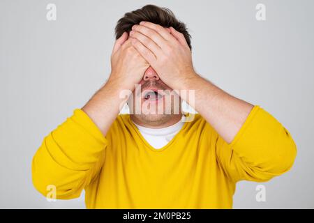 Anonymous caucasian man hiding his identity . Studio shot Stock Photo