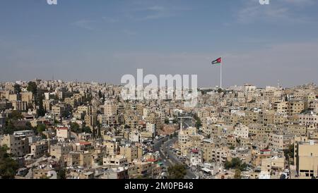 Huge Jordan flag in midtown Amman, landscape view of clear sky background Stock Photo