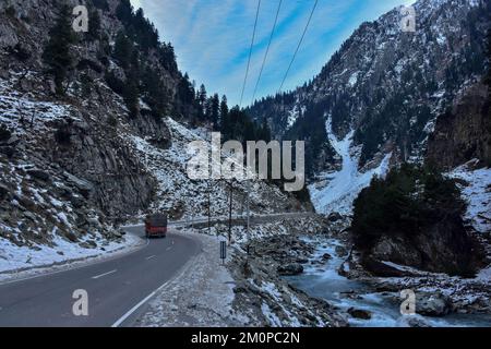 Sonamarg, India. 07th Dec, 2022. A truck carrying goods moves along the Srinagar-Ladakah national highway during a cold winter day in Sonamarg, about 100kms northeast of Srinagar, the summer capital of Jammu and Kashmir. (Photo by Saqib Majeed/SOPA Images/Sipa USA) Credit: Sipa USA/Alamy Live News Stock Photo