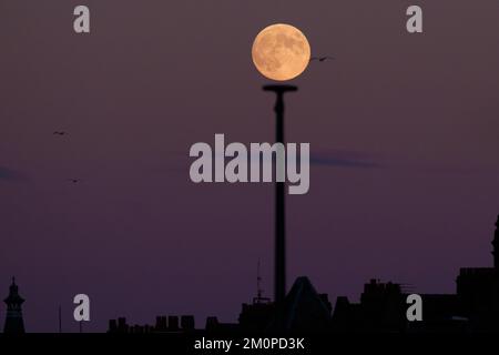 Heysham, UK, 7th Dec. 2022. The final full Moon of 2022 known as the strawberry full moon or the Cold Moon rises above Heysham In Lancashire, UK. Credit: Jon Super/Alamy Live News. Stock Photo