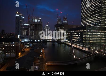 Modern office building in the Canary Wharf financial centre in London UK at night Stock Photo