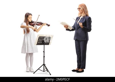 Music teacher holding a stick and paper and a girl playing a violin isolated on white background Stock Photo