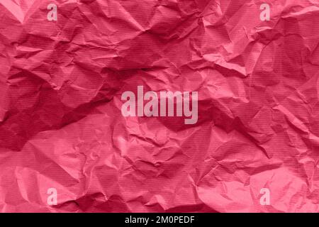 Textured paper background. Recycled paper, crumpled paper, red toned. Stock Photo