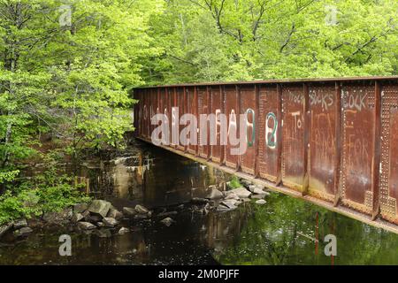 Located on the rail trail here it is now just a pedestrian bridge over Blackwater River in Andover, NH. Stock Photo