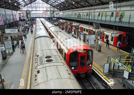 Passengers on platform at Earl's Court underground, tube station London England United Kingdom UK Stock Photo