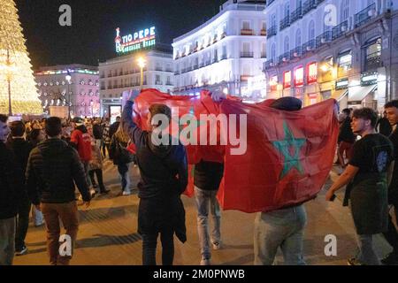 Madrid, Madrid, Spain. 6th Dec, 2022. December 6, 2022 - Madrid, Spain: Moroccan fans with Moroccan flags celebrate in Madrid, Spain after their national team beat Spain on penalties at the Qatar 2022 Football World Cup (Credit Image: © Alvaro Laguna/Pacific Press via ZUMA Press Wire) Stock Photo