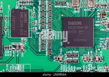 A Samsung Semiconductor RISC microcontroller and DRAM on an integrated circuit board controlling a handheld device. Stock Photo