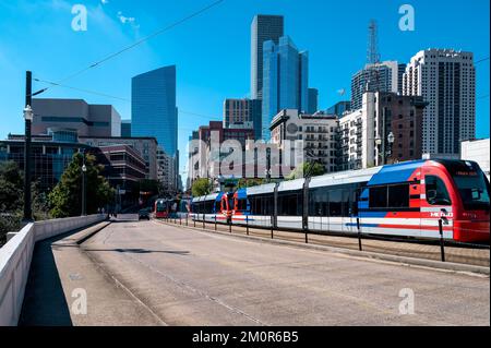 Houston, TX - October 30, 2022: Houston Metro trains heading north and south on Main Street in Houston Texas. Stock Photo