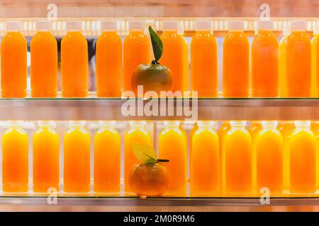 https://l450v.alamy.com/450v/2m0r9m6/fresh-orange-juice-in-bottles-in-refrigerator-shelf-2m0r9m6.jpg