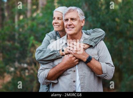 Staying active and enjoying the beautiful scenery. a mature couple out for a hike together. Stock Photo