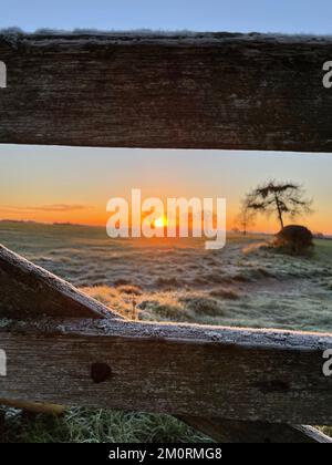 Wintry scenes near Bassetts Pole on the Warwickshire-Staffordshire border, where temperatures remained below zero after sunrise. The Met Office has issued a number of weather warnings for snow and ice for parts of Scotland, Northern Ireland, Wales and the east coast and south-west England over the coming days. Picture date: Thursday December 8, 2022. Stock Photo