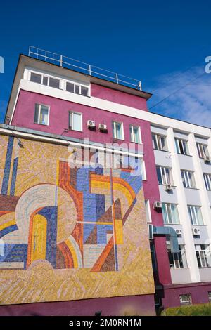 A central Soviet, Russian, Communist era building with a large tile ...