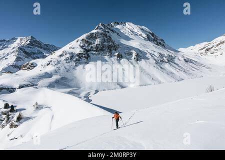 Woman ski touring in Austrian alps in winter, Gastein, Salzburg, Austria Stock Photo