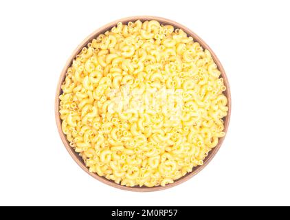 Italian pasta in brown clay bowl isolated on white background. Top view Stock Photo