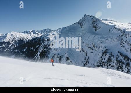 Woman ski touring in stormy weather in the Austrian alps, Gastein, Salzburg, Austria Stock Photo
