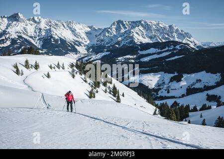 Woman ski touring in the Austrian Alps near Hochkonig region, Austria Stock Photo