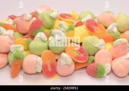Mix of jelly colorful candys and marshmallows isolated on a white background. Stock Photo