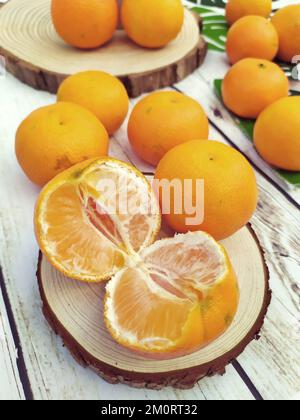 Close-up of fresh oranges on a wooden table Stock Photo