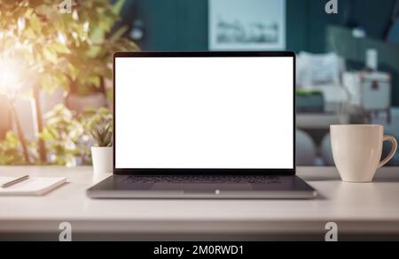 Blank screen laptop on desk Stock Photo