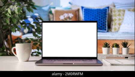 Blank screen laptop on desk Stock Photo
