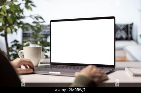 Blank screen laptop on desk Stock Photo
