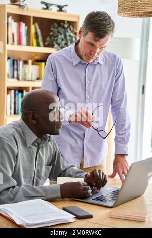 Senior African-American financial advisor helping small company owner with his business Stock Photo