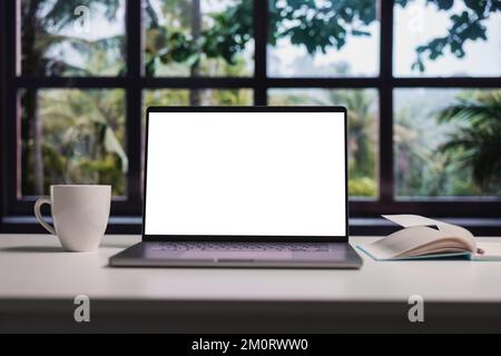 Blank screen laptop on desk Stock Photo