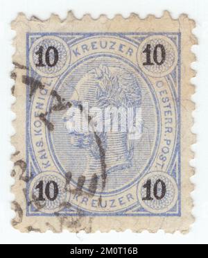 AUSTRIA — 1890: An 10 kreuzer ultramarine postage stamp depicting Embossed portrait of young Austrian Monarch Emperor Franz Josef. Franz Joseph I or Francis Joseph I was Emperor of Austria, King of Hungary, and the other states of the Habsburg monarchy from 2 December 1848 until his death on 21 November 1916. In the early part of his reign, his realms and territories were referred to as the Austrian Empire, but were reconstituted as the dual monarchy of the Austro-Hungarian Empire in 1867. From 1 May 1850 to 24 August 1866, Franz Joseph was also President of the German Confederation Stock Photo