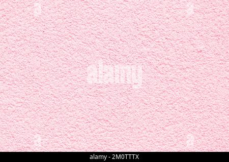 Abstract rough concrete empty wall or stucco texture background in trendy color of the year 2023 Viva Magenta Stock Photo