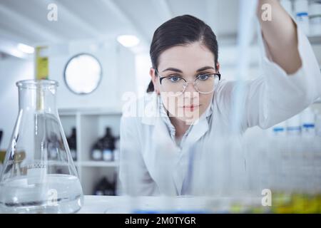 Searching for something new. a young female scientist testing samples. Stock Photo