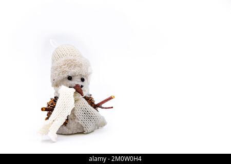 Studio shot of handicraft snowman in white for greeting card cropped against white background Stock Photo